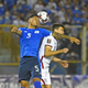El Salvador’s Ronald Rodríguez (L) and USMNT’s Gio Reyna vie collide in their Qatar 2022 FIFA World Cup CONCACAF qualifier.